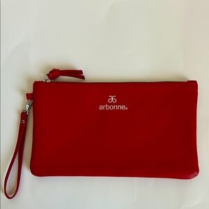 Arbonne red wristlet.